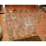 A collection of 19th century and later glassware to include 'penny lick' glasses, etched beakers