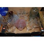 A collection of glassware to include etched drinking glasses, vases etc