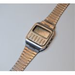 A gentleman's steel cased Seiko quartz LC calculator wrist watch having a digital dial on a bracelet