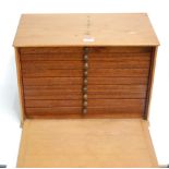 A mid 20th century pine collectors chest the fall front revealing 9 baize lined drawers, width 46cm