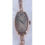 A 9ct yellow gold manual wind wristwatch, with sprung metal bracelet and oval discoloured Arabic