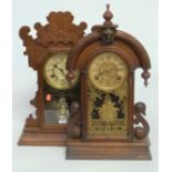 A late 19th century American walnut cased mantel clock having a painted dial with Roman numerals and