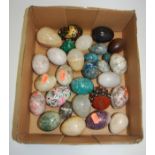 A collection of polished hardstone eggs