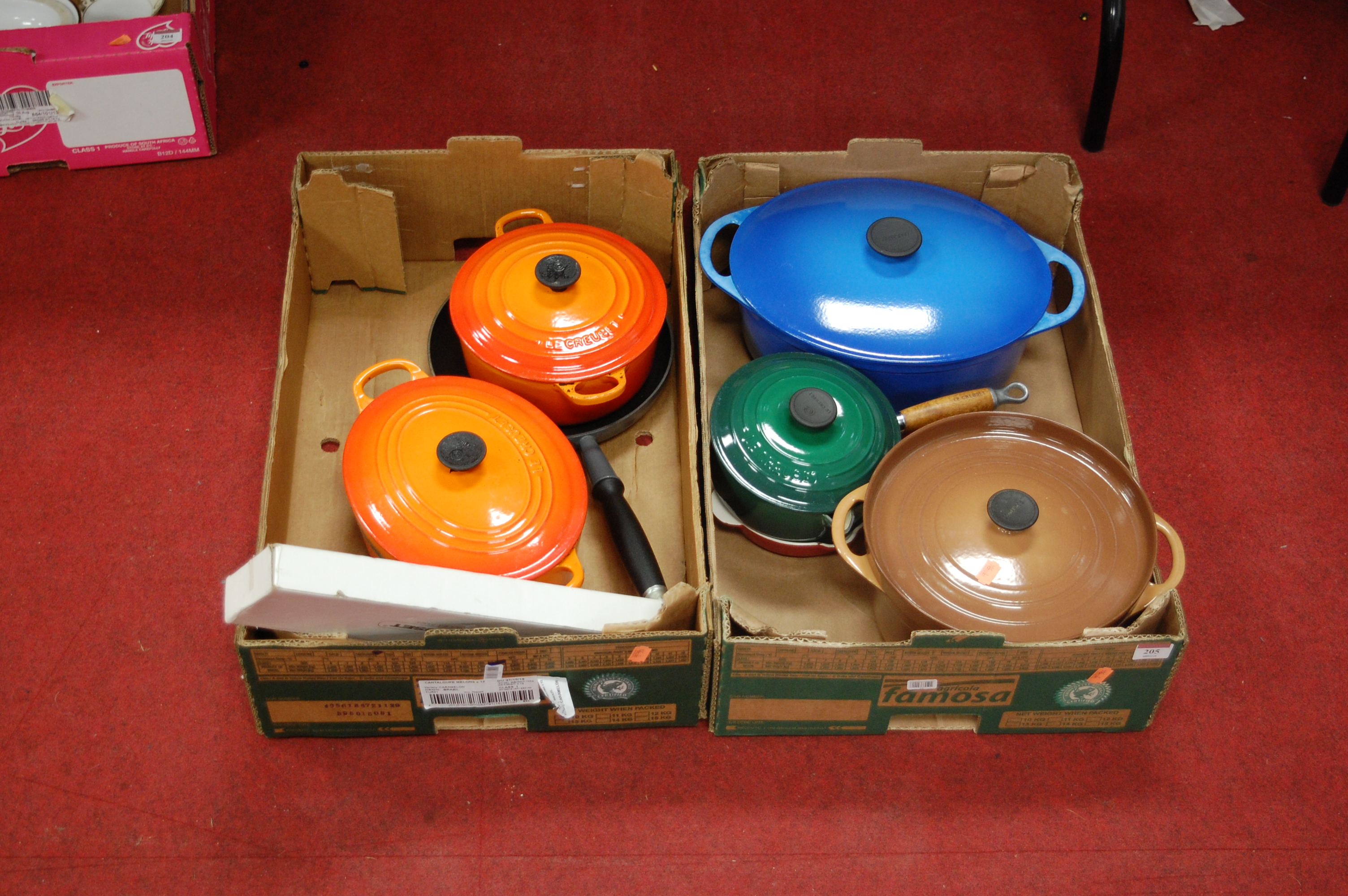 Two boxes of Le Creuset oven wares to include oven dishes, saucepans etc