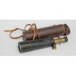 An early 20th century brass and leather clad four drawer telescope, in fitted leather case, length