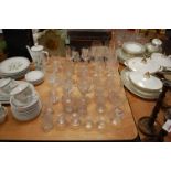 A collection of miscellaneous glassware to include etched glass goblets, champagne flutes etc