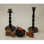 A near pair of 1920s oak spirally turned candlesticks together with a puzzle ball, smoking pipes