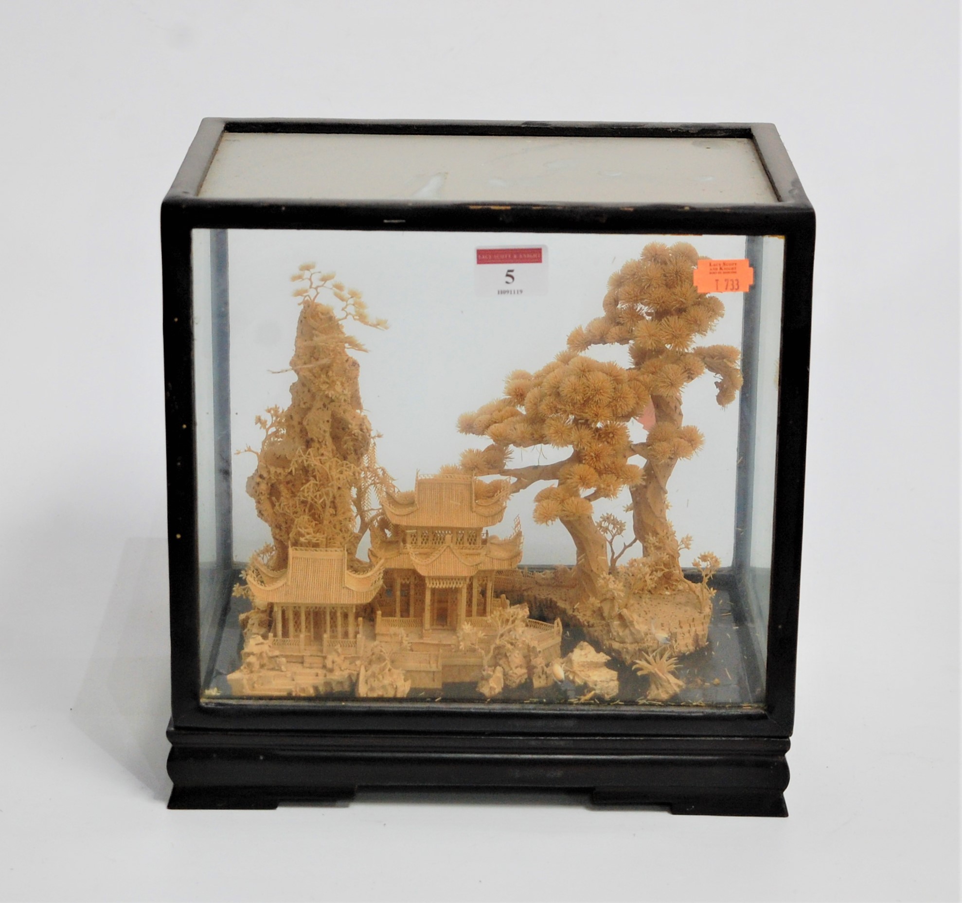 An early 20th century Chinese cork diorama, carved with pagodas within landscape, case w.28cm, d.