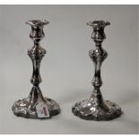 A pair of Victorian style silver plated table candlesticks, each having a removable sconce, with