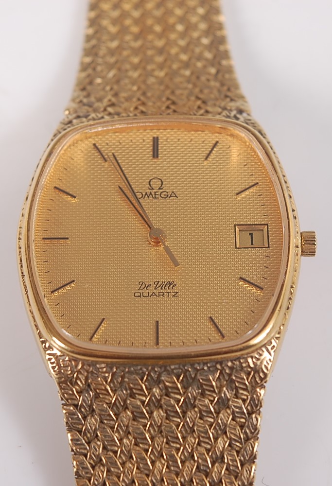 A gent's Omega DeVille quartz wristwatch, having a signed gilded dial with baton markers, date