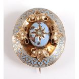 A yellow metal Victorian mourning brooch, comprising an oval border with pale blue enamel inlay