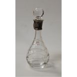 A modern cut glass decanter and stopper, having sterling silver collar by Carr's, h.32cm
