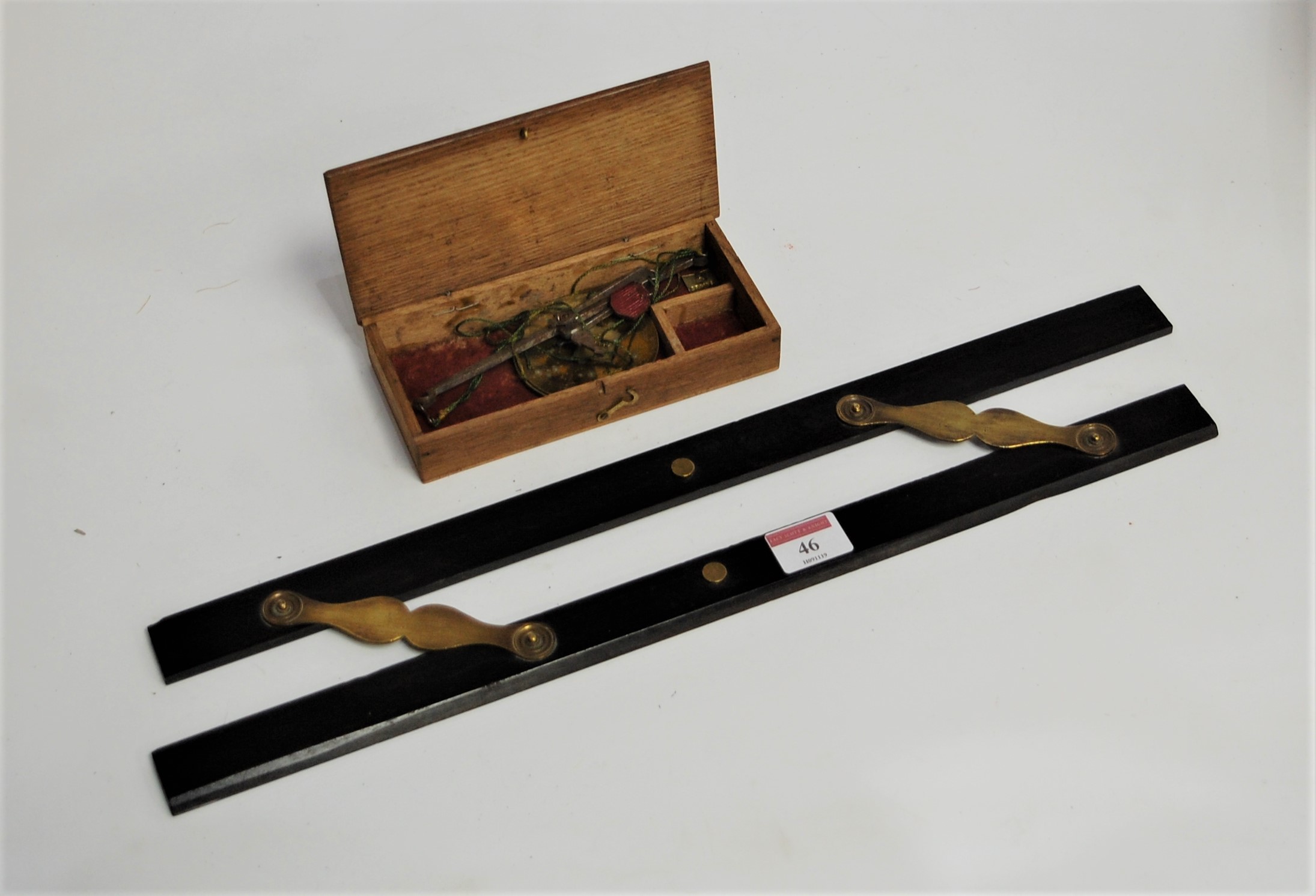 An early 20th century ebony and brass mounted folding rule; together with a set of pawnbrokers