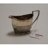 A George V silver cream jug, of oval half-reeded form, maker Horton & Allday, weight 3oz