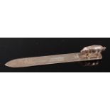 An Edwardian silver bookmark / letter-opener, having plain stem, the terminal surmounted by a