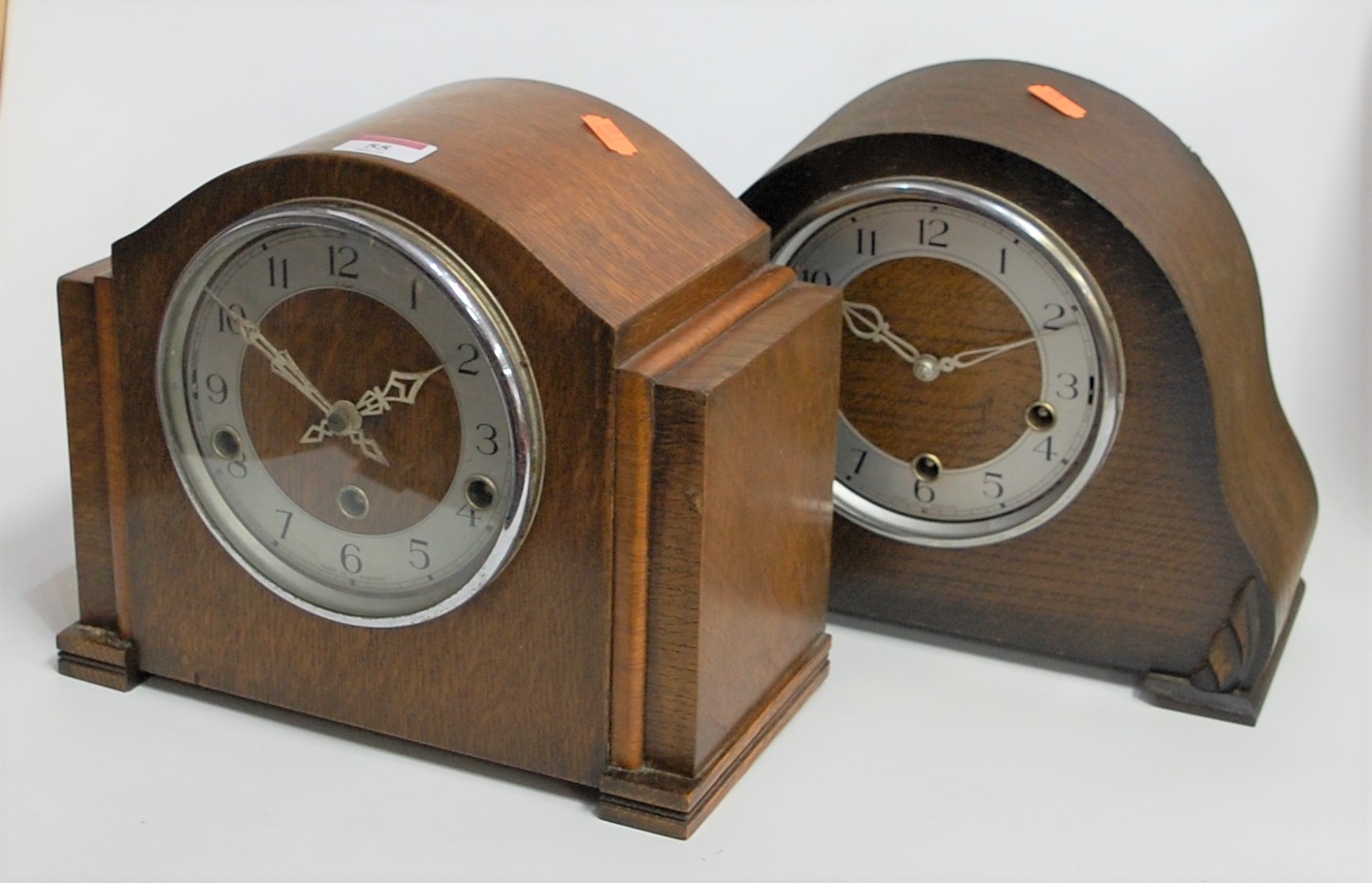 A 1940s oak cased Enfield mantel clock, having a silvered chapter ring with Arabic numerals and