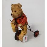 A 1950s Chiltern Products child's push-along bear on tricycle, h.27cm
