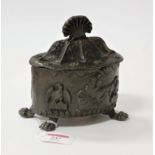 An early 19th century lead tobacco jar and cover, the domed lid with shell cast finial, the body