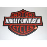 A reproduction cast iron Harley Davidson Motorcycles advertising sign