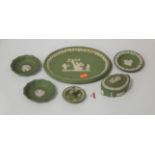 A small collection of Wedgwood green jasperware, to include ring tree, oval dish, trinket jar and