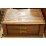 A 1920s oak cutlery canteen, case only, the hinged lid revealing red brushed velvet lined interior