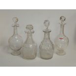 A pair of Edwardian decanters and stoppers, each etched with swags and bows, h.31cm; together with a