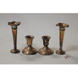 A pair of Edwardian silver trumpet shaped spill vases, on loaded base, h.13cm; together with a