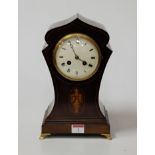 An Edwardian mahogany, box wood strung and satinwood inlaid lancet shaped mantel clock having a