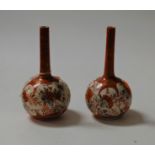 A pair of Japanese Meiji period Kutani bottle vases having three character mark verso, height 18cm