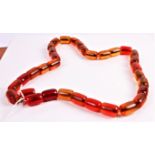 A faux cherry amber beaded necklace, 72cm