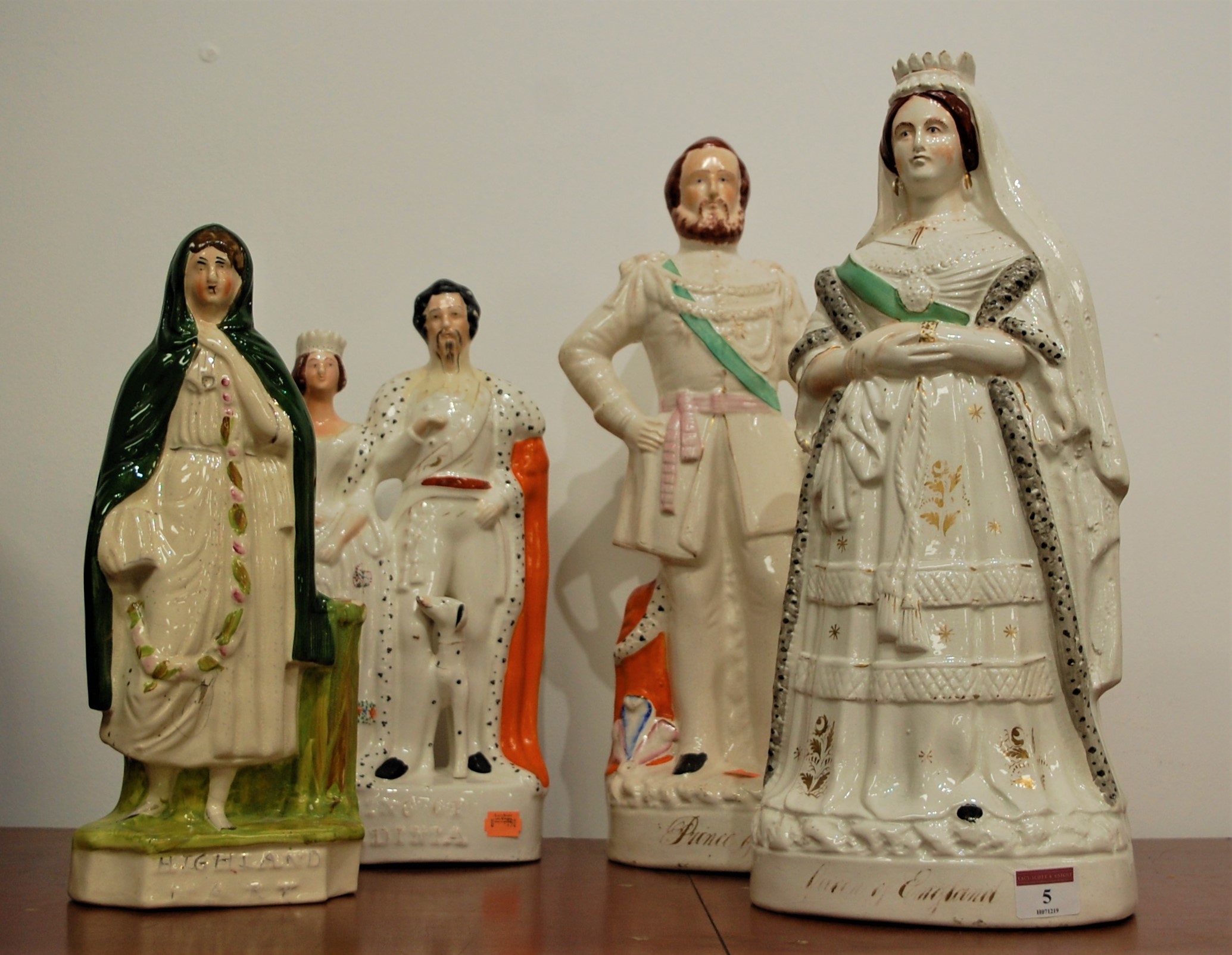 A pair of large Victorian Staffordshire figures of Queen Victoria and the Prince of Wales, height