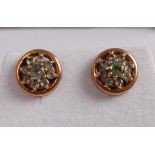 A pair of 9ct gold and chrysoberyl set ear studs, dia.8.5mm