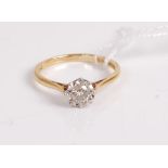 An 18ct gold diamond solitaire ring, the illusion set round cut diamond weighing approx 0.25 carats,