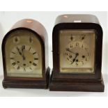 A 1920s mahogany dome-top mantel clock, having arched silvered dial with Roman numerals, chiming