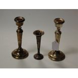A pair of modern silver table candlesticks, each on a loaded base, h. 19cm together with a silver