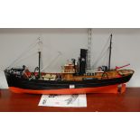 A large kit built model of a trawler