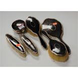 A George V silver and tortoiseshell dressing table set to include ring box, various hand brushes and