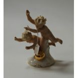 A continental porcelain figure of two children with a ball, h.19cm