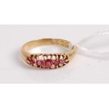 An 18ct gold five ruby set ring, 2.1g, size I