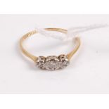 A vintage 18ct gold and platinum diamond ring, as three illusion set small old cuts, 2.1g, size T