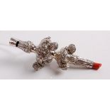 An early Victorian silver and embossed baby's teething whistle and rattle, with coral teether,