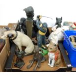 A collection of various plaster and pottery figures, mainly of cats