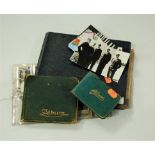 Two early 20th century leather bound autograph albums and contents, and various black and white