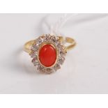 An 18ct gold, coral and cz set dress ring, 3.9g, size O