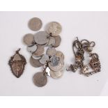 A silver and white metal coin bracelet with various coins from around the world, together with