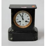 A late 19th century marble cased mantel clock having a circular enamel dial with Roman numerals