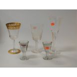Two Victorian penny lick glasses each of typical conical form together with an Ely Cathedral