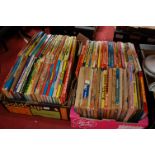 Two boxes of assorted children's annuals to include The Dandy, Buster, Six Million Dollar Man,