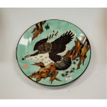 A large Japanese charger, enamel decorated with an eagle in flight, bearing label verso 'Japanese