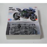 A boxed Tamiya unbuilt 1/12 scale plastic kit model of a Kawasaki Ninja motorcycle